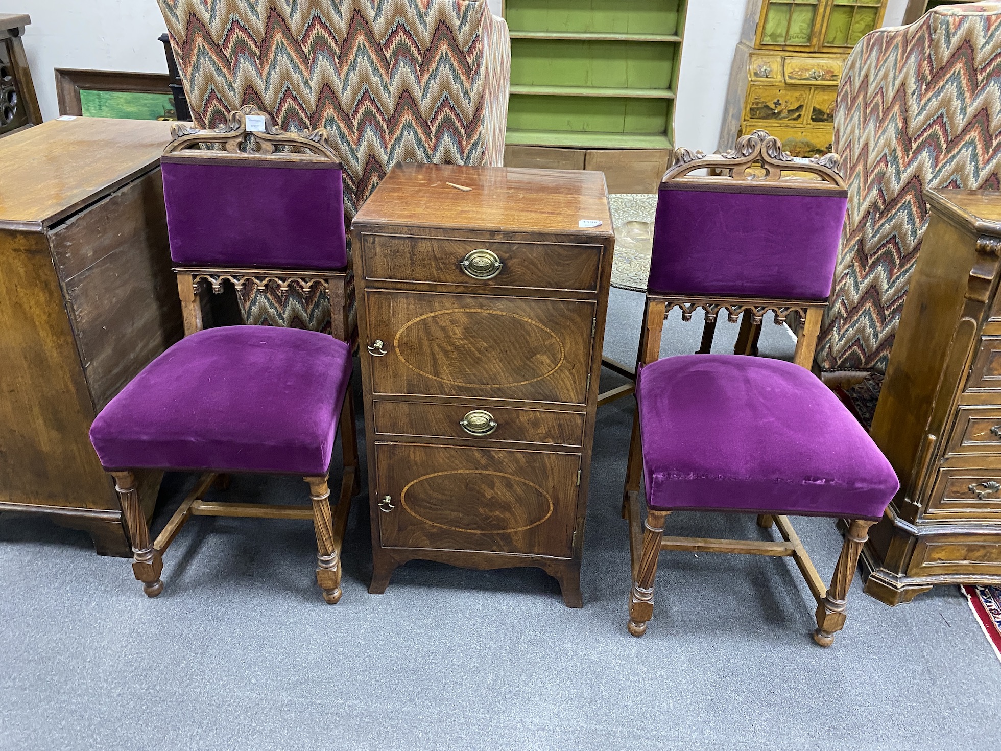 A pair of Victorian oak Gothic revival dining chairs, width 46cm, height 97cm